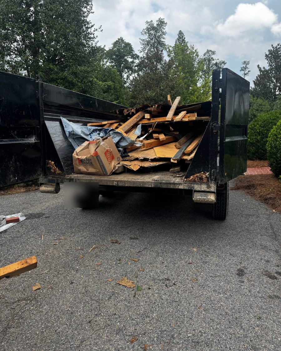 Dump trailer loaded with demolition debris for haul-off in Augusta GA